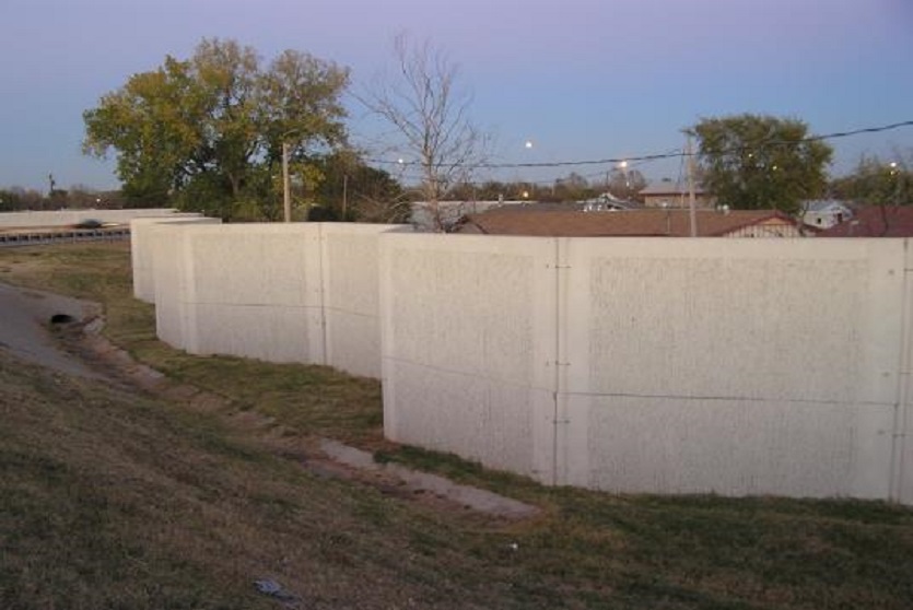 Precast concrete barrier, FanWall, used as a sound barrier and security barrier.