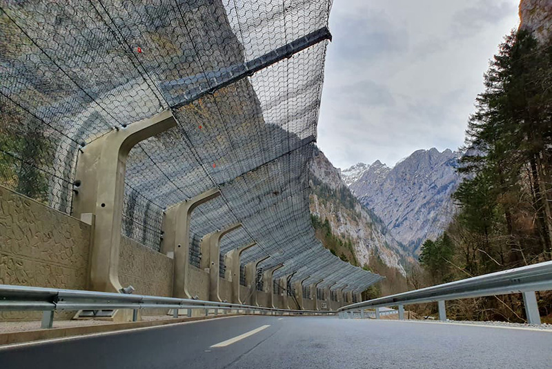 Rockfall barrier -rockfall-protection-fence over a road in a mountainous area