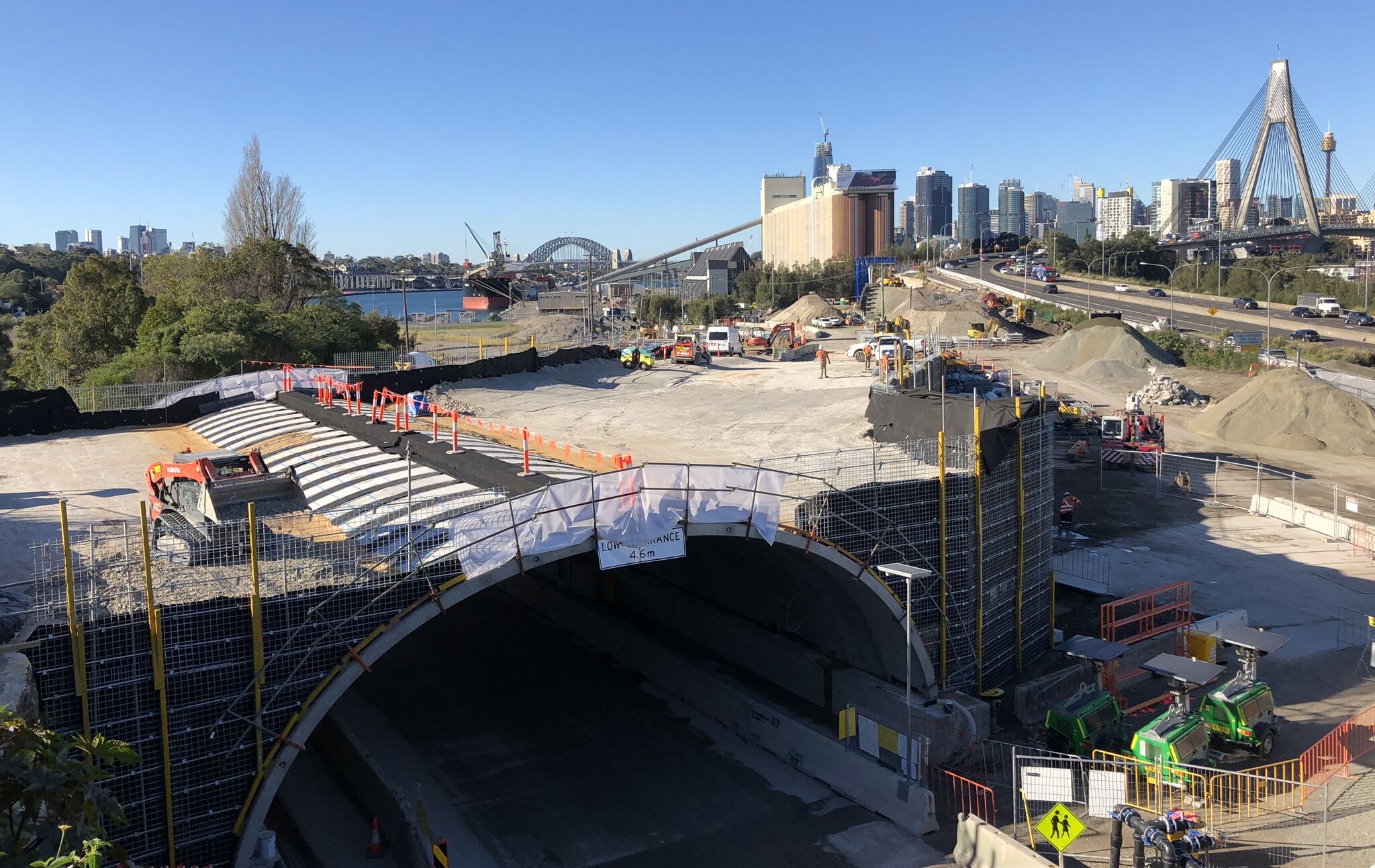 Precast concrete arch solution, TechSpan® by Reinforced Earth pictured in the foreground of the Sydney Harbour Bridge during the construction of the Rozelle Interchange in NSW