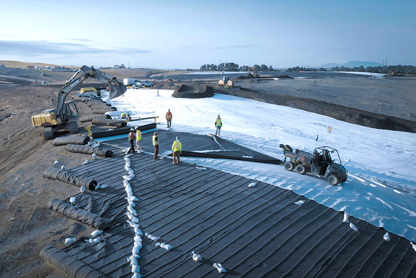 The geotextile, TechRevetment™ formed concrete mattresses, part of the geosynthetics solutions for erosion control. Pictured on a beach erosion area retaining the sandy slope